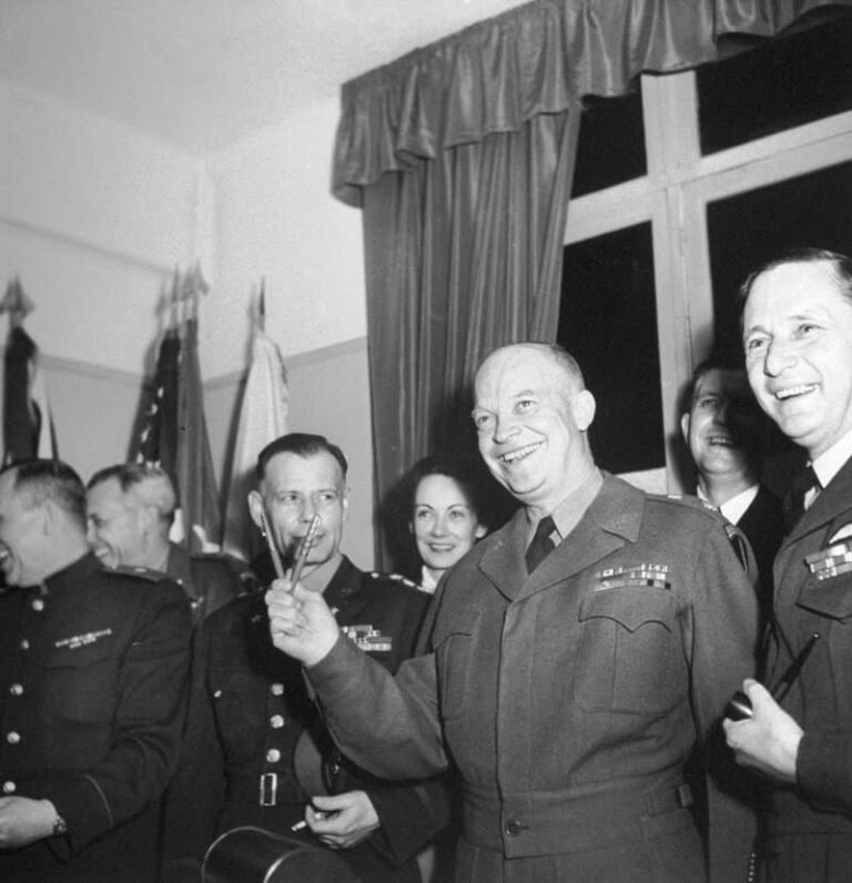 3 Built to Divide 11-gen.-dwight-eisenhower-celebrates-the-end-of-world-war-ii-in-europe-by-holding-the-pens-used-to-sign-the-surrender-document